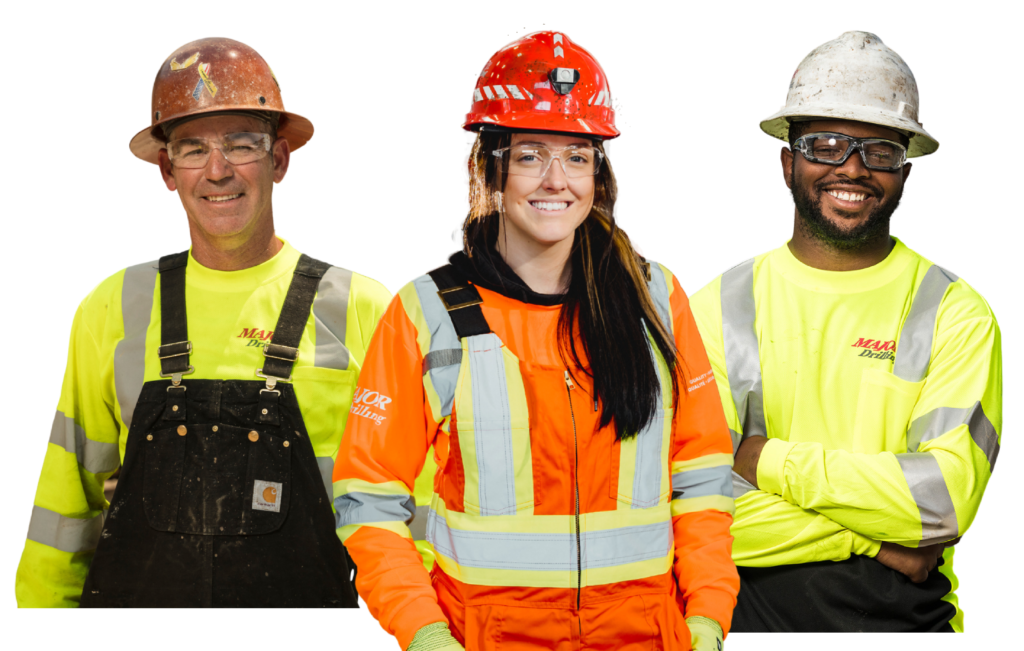 A diverse group of three Major Drilling Group International Inc. employees dressed in PPE standing in hero pose