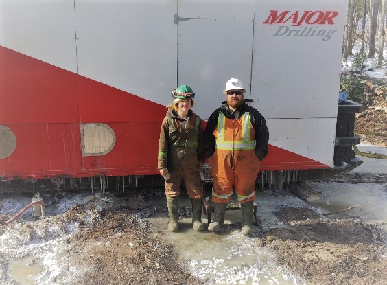 Woman and man in front of Major Drilling drill rig